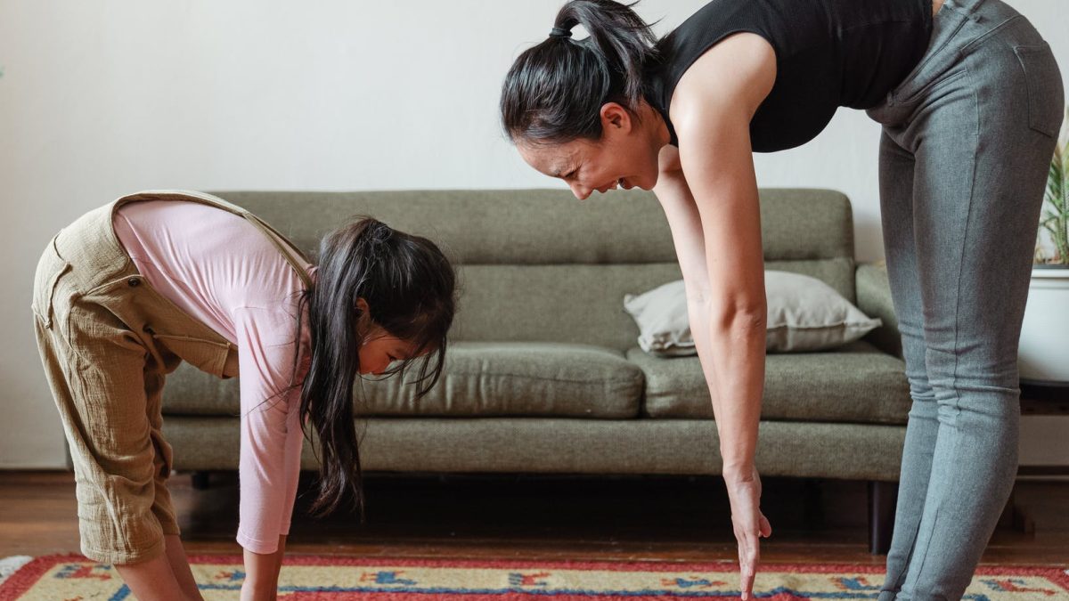 woman exercising with her daughter